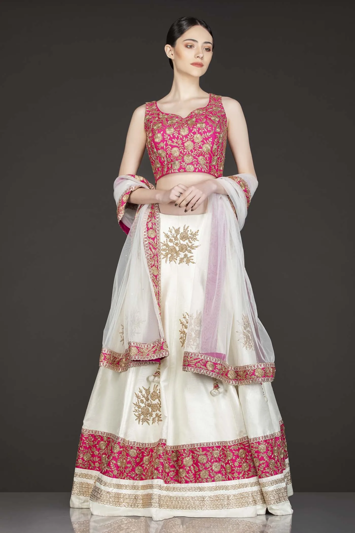 Fuchsia Pink Silk Top With Ivory Silk Lehenga With Net Dupatta