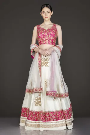 Fuchsia Pink Silk Top With Ivory Silk Lehenga With Net Dupatta